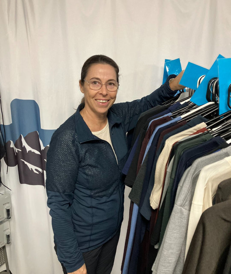 Fleur checking a LOOW merino garment for holes