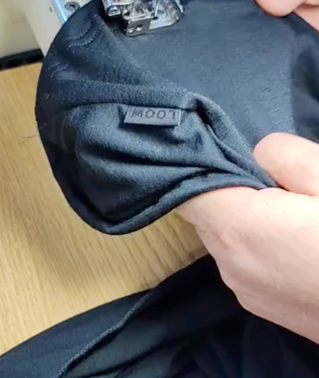 A LOOW merino garment being sewn at Wijmar Sport