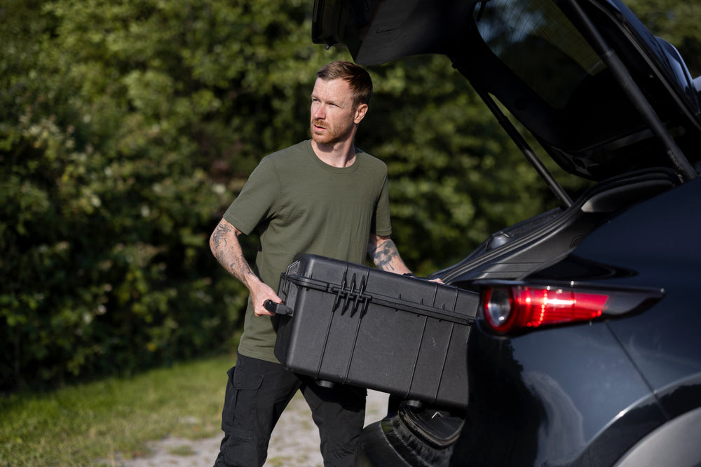 Packing equipment for a day of work in a green LOOW merino T-shirt